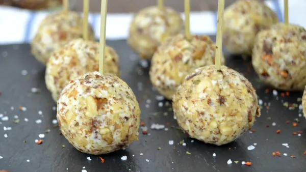 Cheese with truffles, green apple, and nuts
